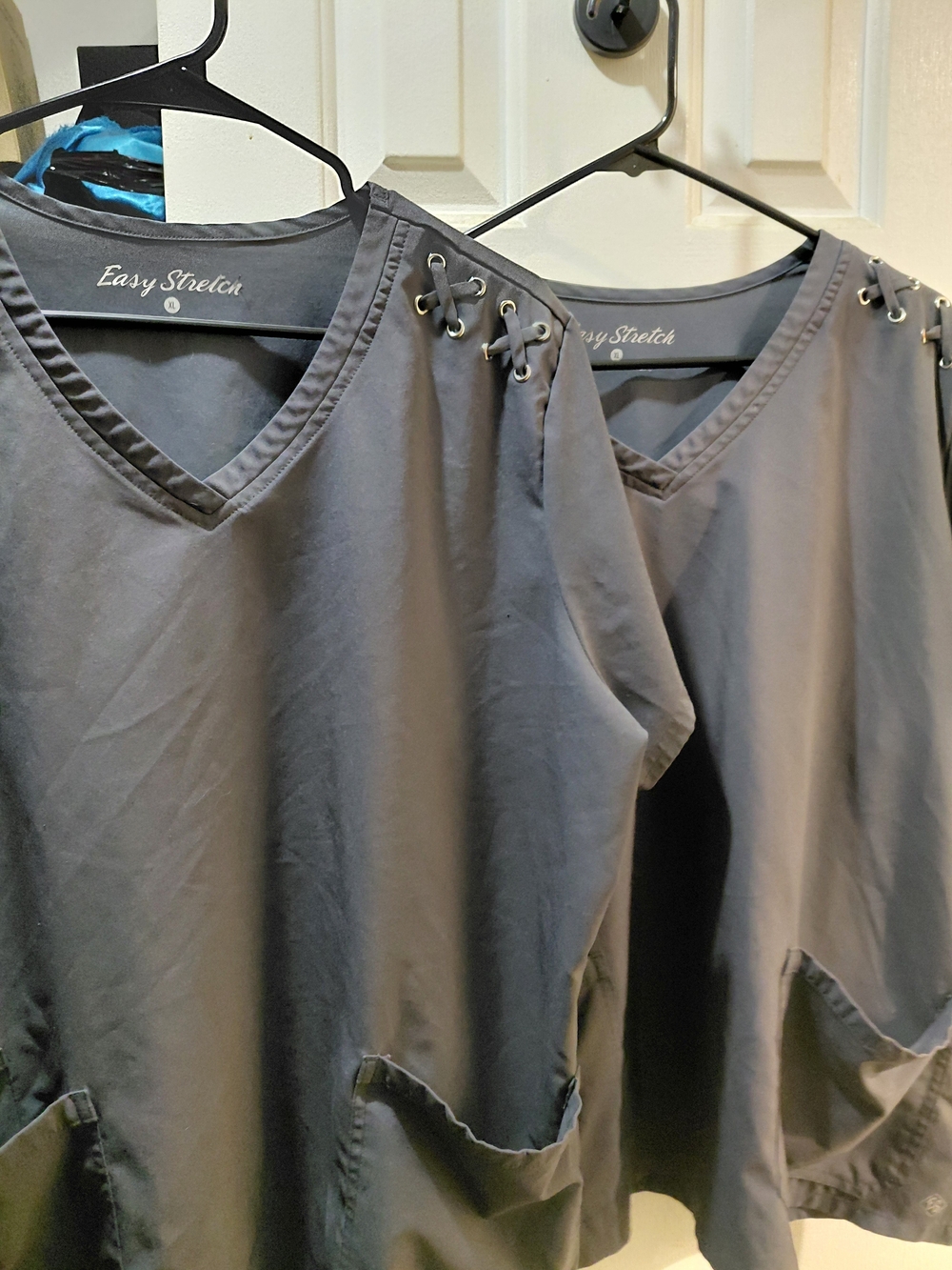 Two Women’s V-Neck Grey Scrub Tops with Shoulder Eyelet Detail